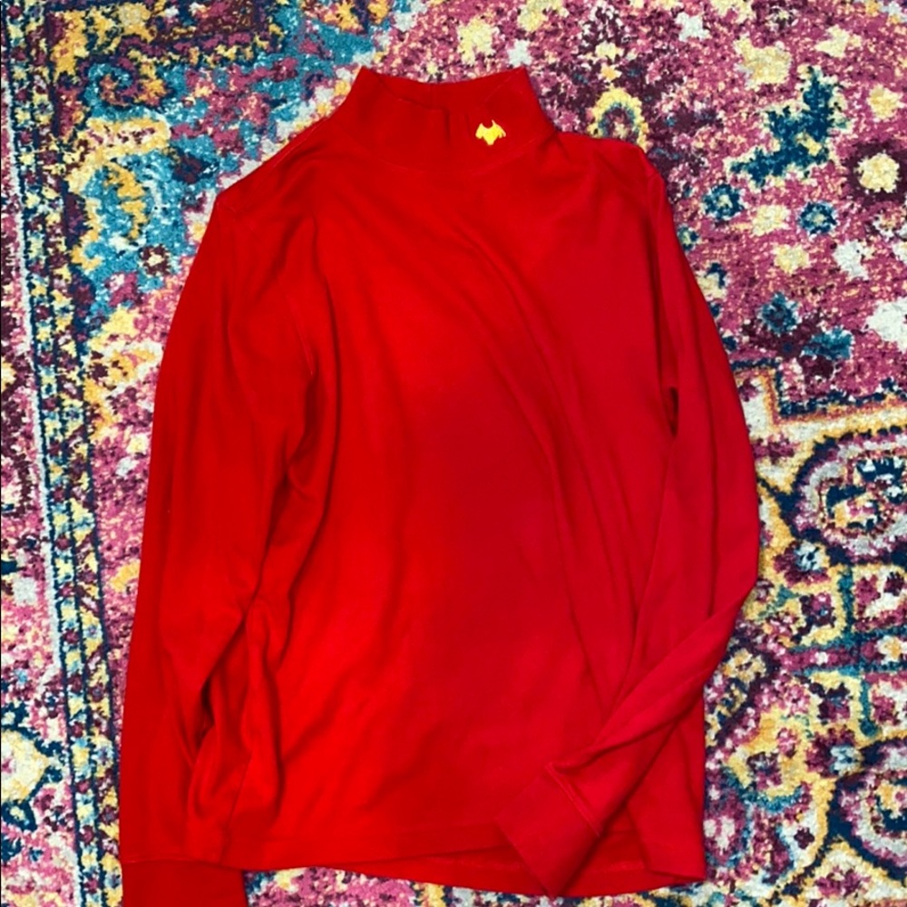 Red turtle neck with little gold dog on the neck